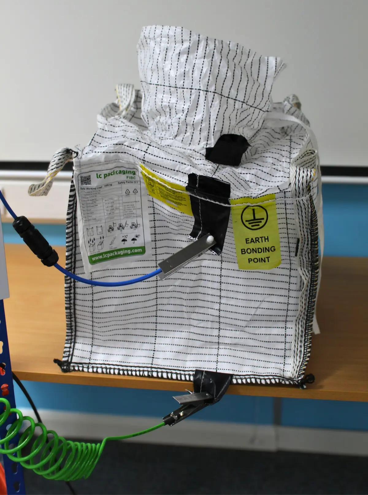 Type C FIBC connected to a verified earthing point using two earthing clamps